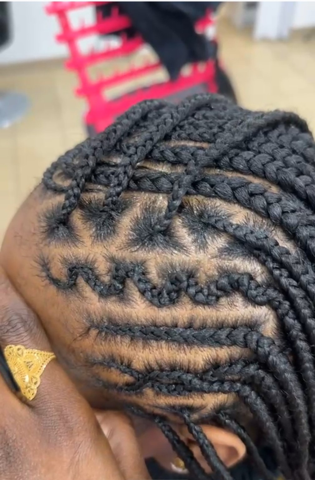 African hair braiding style by The Sister's African Hair Braiding